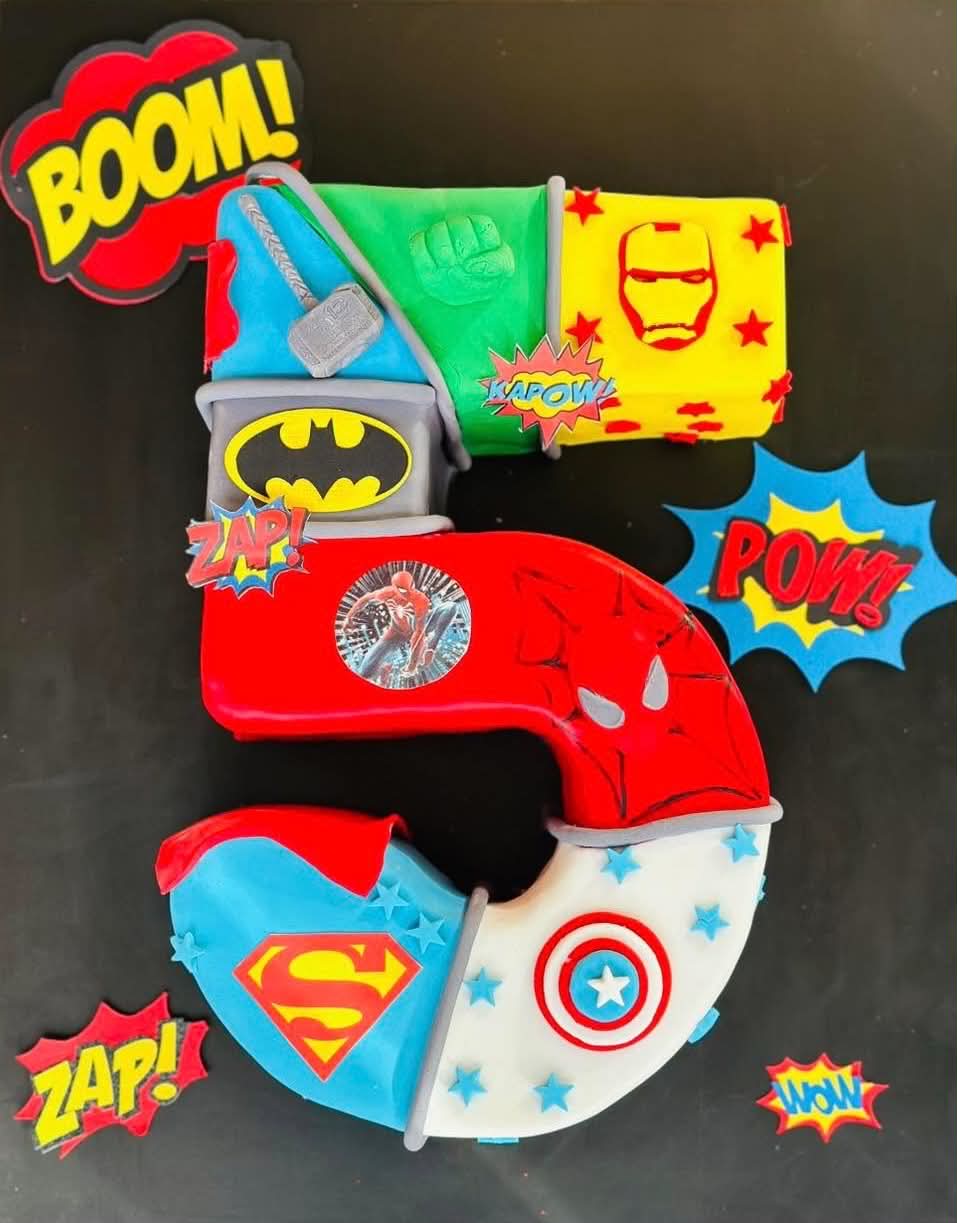 Number 5 shaped superhero cake featuring Batman, Spiderman, Superman, Hulk, Iron Man and Captain America